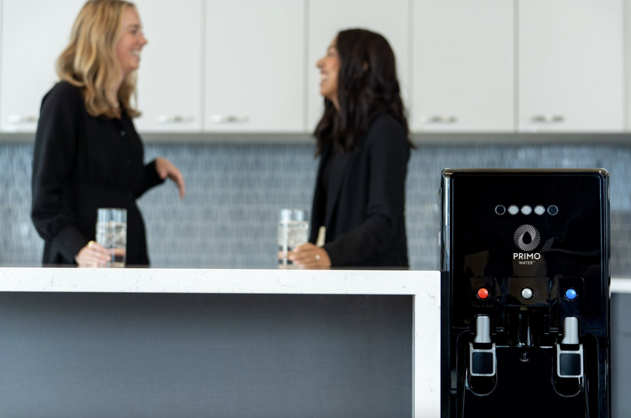how to stay hydrated at work - water in breakroom